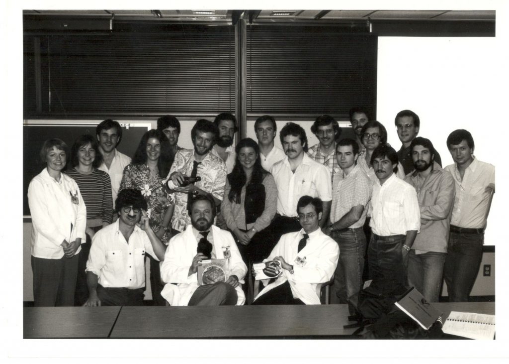 A group of medical students gather in a lab.